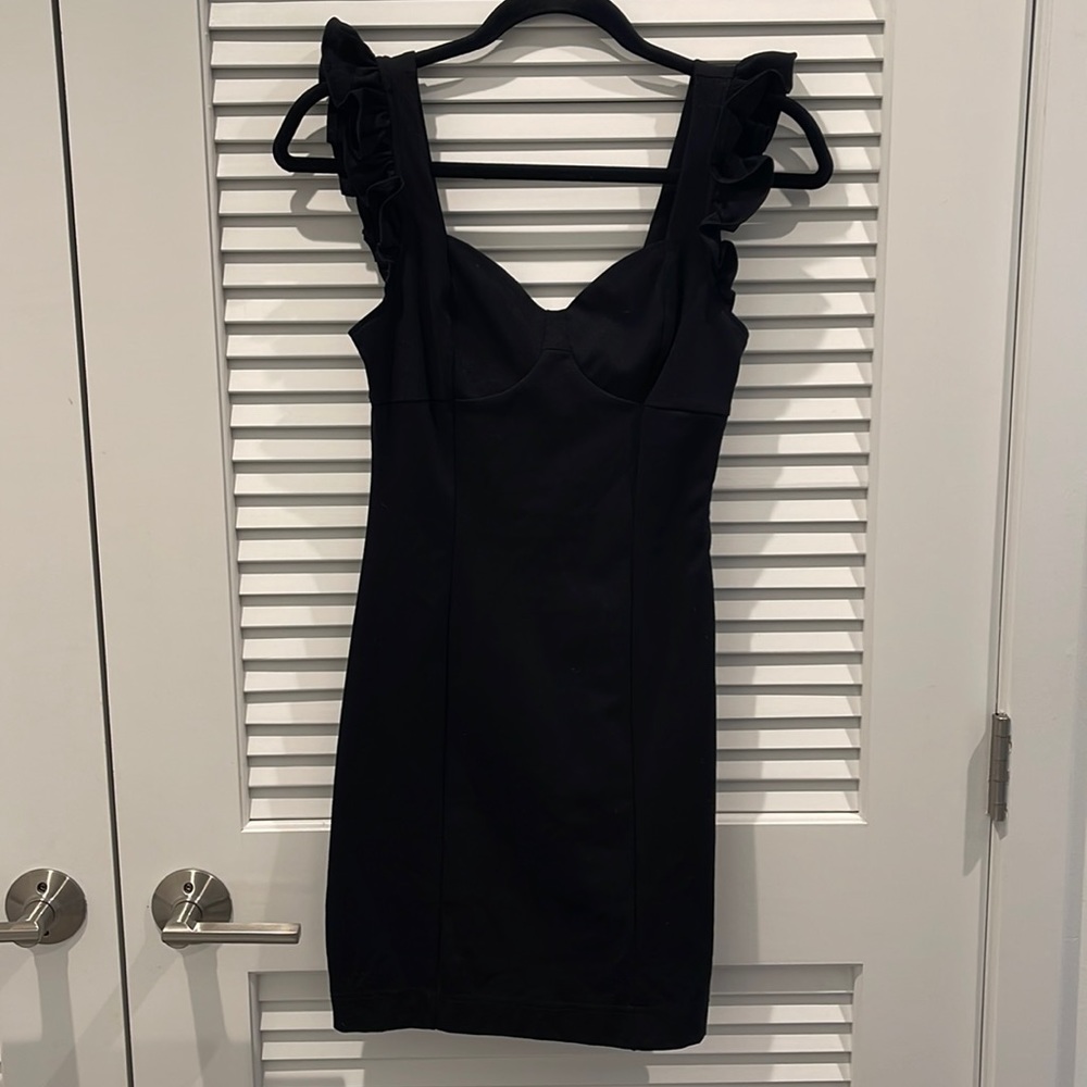 Black mini dress with ruffled sleeves